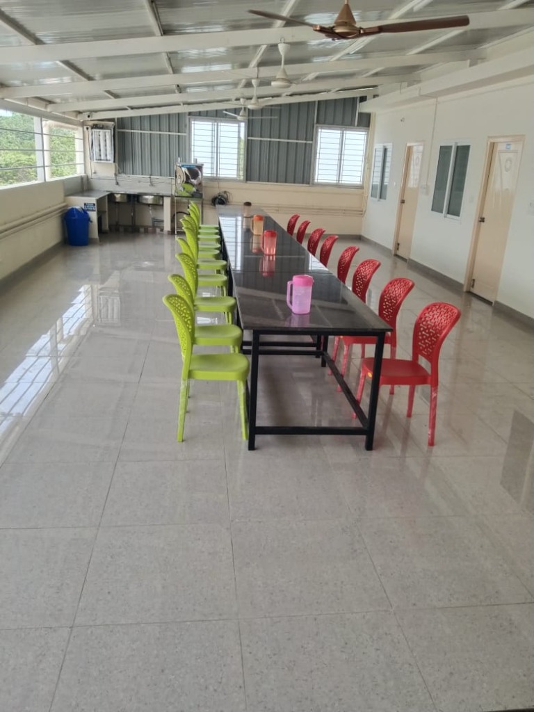 Rooftop dining hall at VStay PG