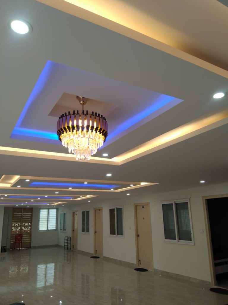 VStay PG premium lobby with chandelier lighting, Hulimavu Bangalore