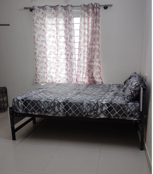 Single bed room with wardrobe and workspace at VStay PG