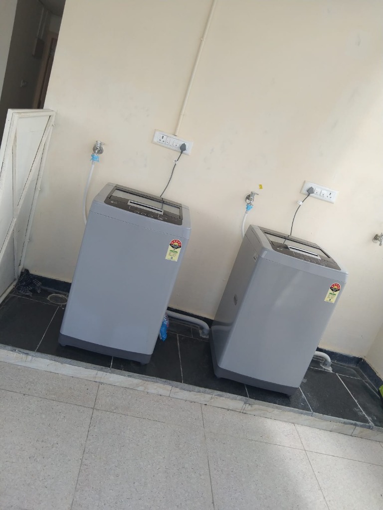 Washing machines laundry area at VStay PG
